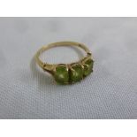 9ct yellow gold and peridot three stone ring, approx total weight 2.0g