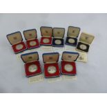 Nine silver proof coins in fitted cases, to include COAs