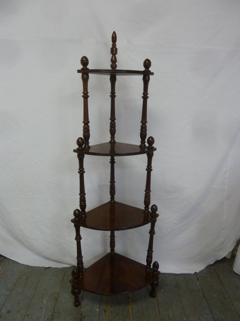 A mahogany graduated four tier whatnot with turned columns