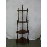 A mahogany graduated four tier whatnot with turned columns