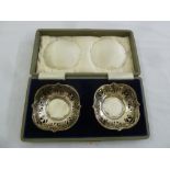 A pair of silver bonbon dishes in fitted case