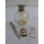 A quantity of silver to include a vesta case, a cigar cutter, a pencil and a perfume bottle