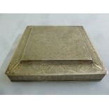 A Persian white metal square box profusely engraved with leaves and scrolls, the hinged cover