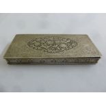 A Persian white metal cigarette box, rectangular the hinged cover and sides chased and engraved with