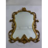 A gilded wooden shaped rectangular Art Nouveau style wall mirror