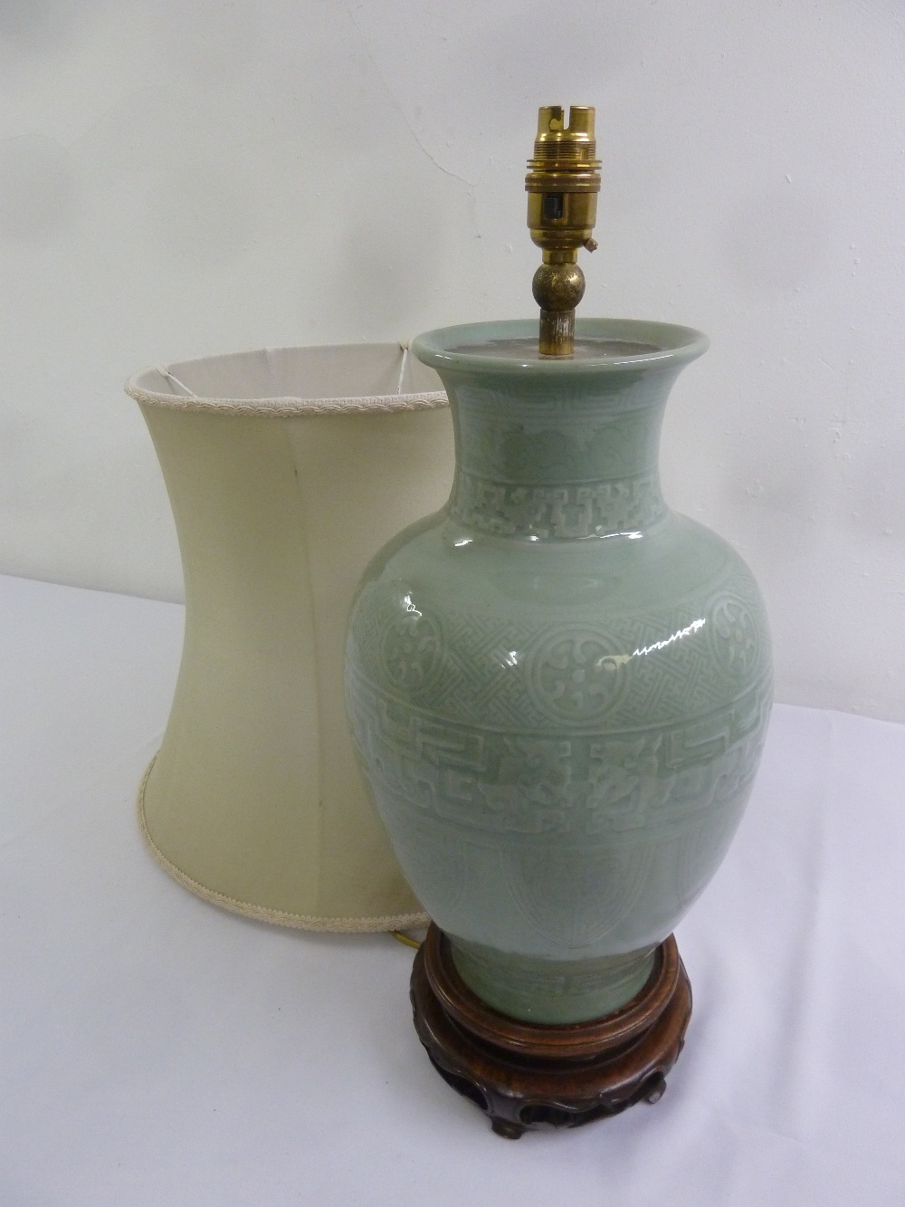 A Chinese celadon baluster form table lamp and shade