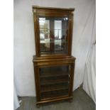 A late Victorian mahogany glazed break front display cabinet with five shelves on four turned feet