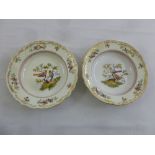 A pair of Meissen bowls decorated with images of birds and flowers, marks to the bases, A/F