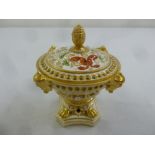 An early 19th century English porcelain potpourri bowl with pierced pull off cover and bud finial