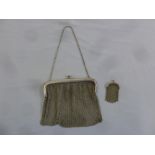 A ladies hallmarked silver mesh evening bag with matching coin purse