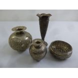 A quantity of Persian white metal to include three vases and a bowl