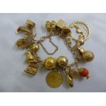 9ct gold charm bracelet with fourteen charms, approx total weight 53.7g