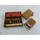 A cased set of scientific equipment and a mid 20th century Polaroid camera in fitted leather