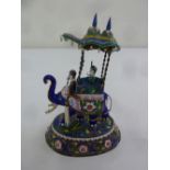 An Indian enamel figurine of two men on an elephant on raised circular base, 19cm (h)