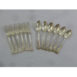 A set of six Victorian silver Queens pattern spoons and forks, London 1850