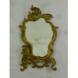A French late 19th century ormolu table mirror in the Rococo style