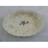 A Meissen early 20th century oval dish with flowers and gilded maple leaves, marks to the base