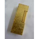 A Dunhill gold plated cigarette lighter