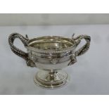 A George III silver two handled bowl with gadrooned borders and entwined cornucopia side handles