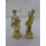 A pair of late 19th century porcelain figurines in 18th century costume, gold anchor mark to the