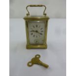 Brass carriage clock of customary form with key