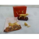 Three Oriental gold plated figurines