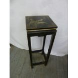 A Chinese rectangular ebonised plant stand on four legs
