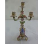 A Meissen style four light candelabra decorated with flowers, leaves and fruit