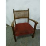 A mahogany and bergere childs chair with upholstered seat