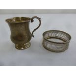 A silver christening mug with scroll handle on raised circular base, Birmingham 1922 and a bar