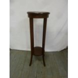 An Edwardian mahogany plant stand circular with tapering rectangular legs