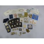 A quantity of GB coins to include proof sets, commemoratives and two ten shilling bank notes