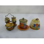 Clarice Cliff Bizarre condiment set, sugar bowl and a honey pot, A/F