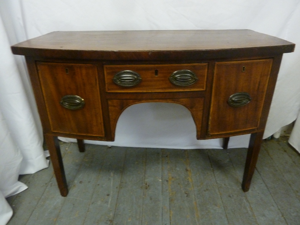 A Regency rectangular desk with brass handles on four tapering rectangular legs