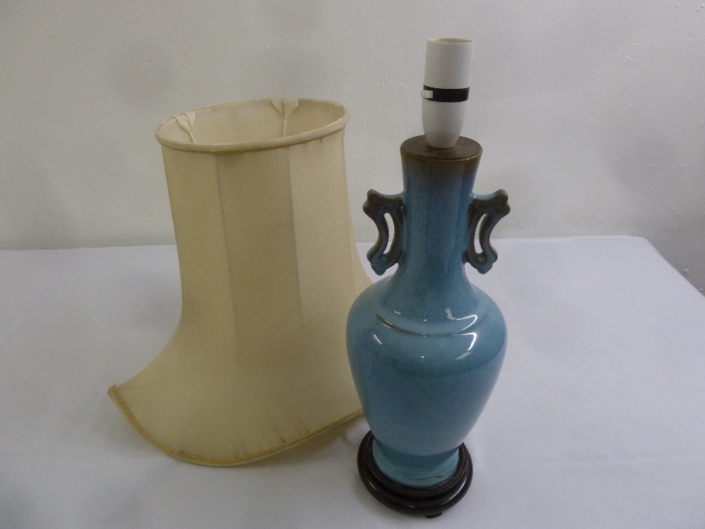 A Chinese blue ground two handled porcelain table lamp and shade