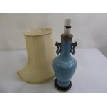 A Chinese blue ground two handled porcelain table lamp and shade