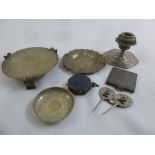 A quantity of Persian white metal to include a candlestick, two ashtrays and a picture holder (8)