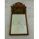 An early 20th century rectangular wall mirror with painted floral still life and applied shell