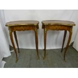 A pair of French late 19th century kidney shaped side tables with parquetry and inlay design with
