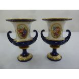 A pair of Royal Worcester campagna form vases with hand painted floral panels by E. Phillips