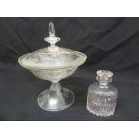 A covered glass dish on raised base and a cut glass scent bottle with glass stopper