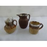 Two silver mounted stoneware jugs and a silver mounted mug all with hunting interest