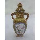 A Chinese enamelled two handled vase and cover