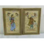 A pair of framed and glazed Persian watercolours of figures in traditional dress, 41 x 24cm
