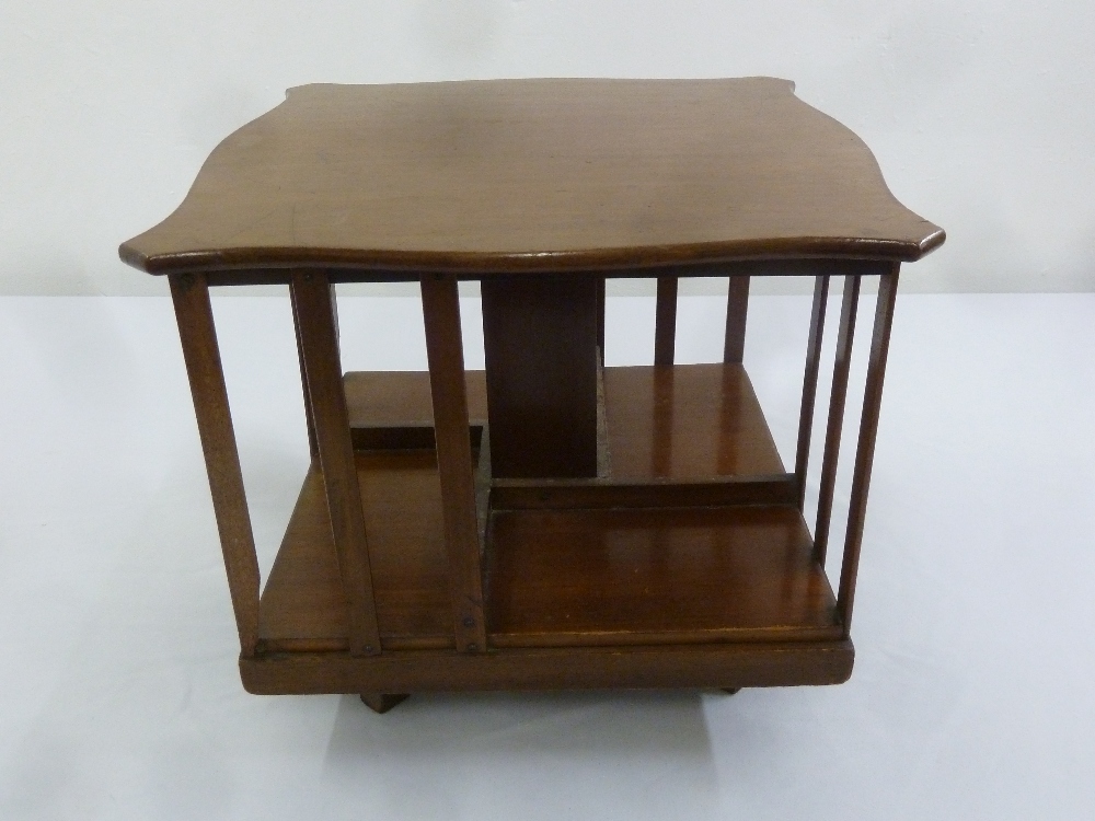 An Edwardian mahogany rectangular revolving table top book case