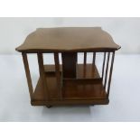 An Edwardian mahogany rectangular revolving table top book case