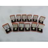 Twelve £1 silver Piedfort coins in original fitted packaging