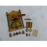 A quantity of Militaria to include medals and a compass holder