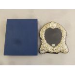 A heart shaped silver mounted photograph frame in original packaging
