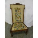A Victorian upholstered mahogany prayer chair on turned legs